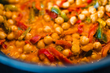 plant-based food, vegan chickpeas red pesto stew with capsicums and spices