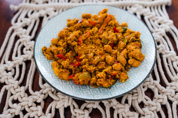 plant-based food, vegan chickpeas red pesto stew with cous cous and capsicums and spices
