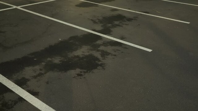 A Parking Space Delimited by White Marks Filmed from Above