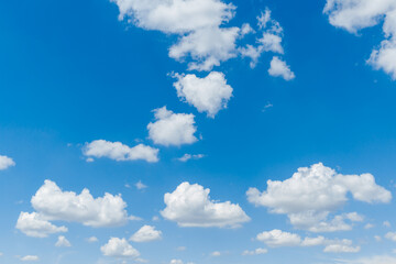Obraz na płótnie Canvas Blue clear sky with white fluffy clouds. Natural background