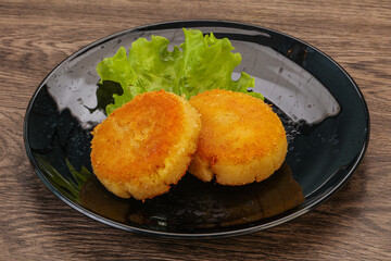 Vegan cuisine - Potato cutlet in the plate