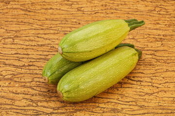 Young tasty zucchini over board