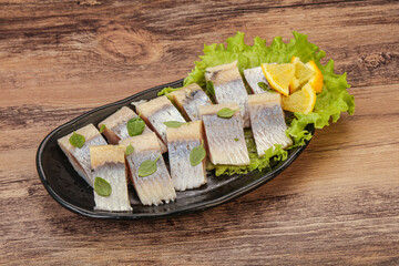 Herring fillet with sliced lemon
