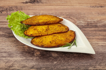 Baked potato with herbs and spices