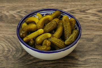 Pickled gherkin in the bowl