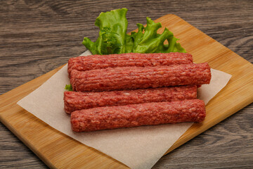 Raw beef sausages with spices