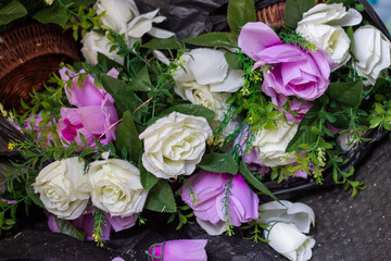 pile of fake plastic rose flowers