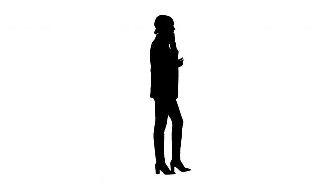 Silhouette Bossy Businesswoman talking on her phone.
