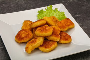 Fried chicken nuggets served salad leaves