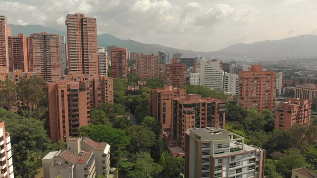 Medellin, Colombia.  Aerial View of Modern Residential Buildings in El Poblado  Neighborhood Under Cloudy Sky