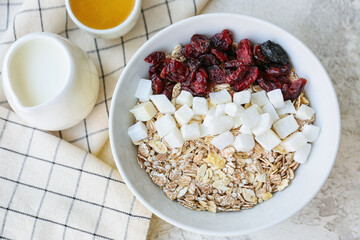 Bowl with tasty sweet oatmeal on table
