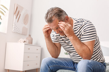 Stressed mature man at home