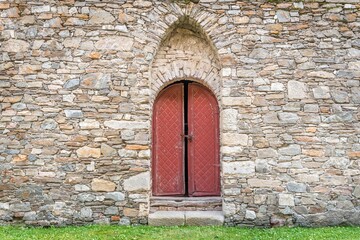 Fototapeta na wymiar Medieval wooden door in old church