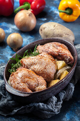 Chicken thighs and potatoes ready for baking