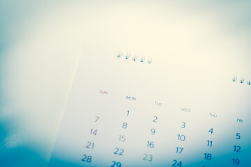 Blurred calendar in blue tone.