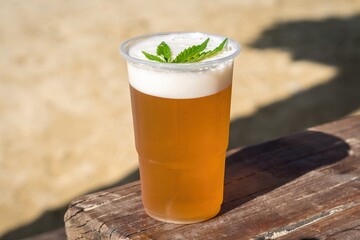 Cannabis beer with herbal leaf of marijuana