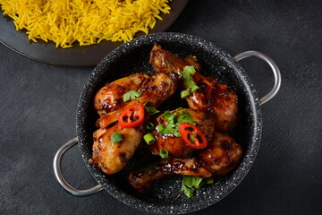 Tandoori chicken with fresh chicken dough and crispy Indian spices and yellow wild rice cooked with curcuma turmeric spice