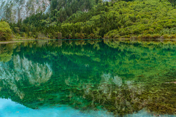 The beautiful turquoise water in ,lakes with forest in Jiuzhai Valley, in Sichuan, China, summer time.