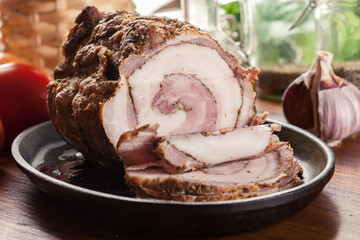Baked pork belly roulade. Bacon rolls