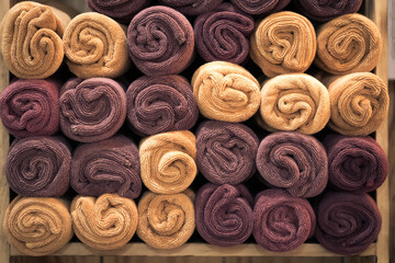 Colorful purple violet beige rolled up towels for Barbershop, Spa Bath Swimming pool, sea Beach,...