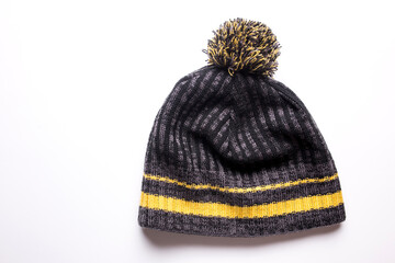 Men's winter hat in gray and yellow on a white background.