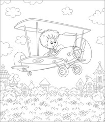 Little cheerful boy piloting his small toy plane among clouds in summer sky over a park near cute town houses on a sunny day, black and white outline vector cartoon illustration for a coloring book pa