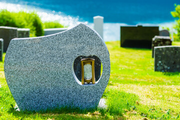 Churchyard in Nes village at fjord, Norway