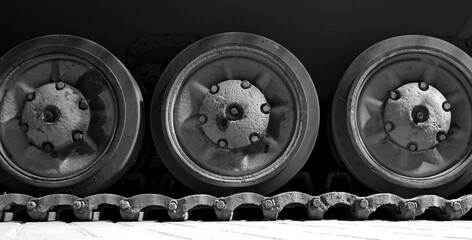 Obraz na płótnie Canvas Tracks and wheels of tank, armored vehicle