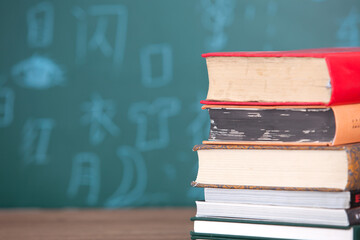 Book in front of blackboard