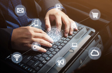 Businessman working on his laptop while sitting in the car-Network connection concept