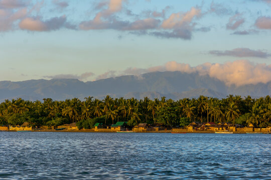 Late afternoon by the coast and beach of Bato, Leyte with mountains at the background.