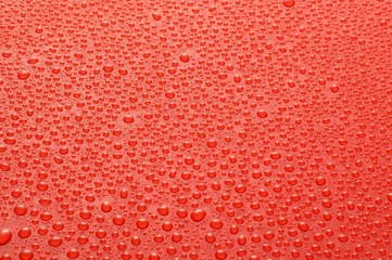 Drops water on the clear glass red background. Water condensation