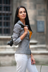 Young female photographer in the old town