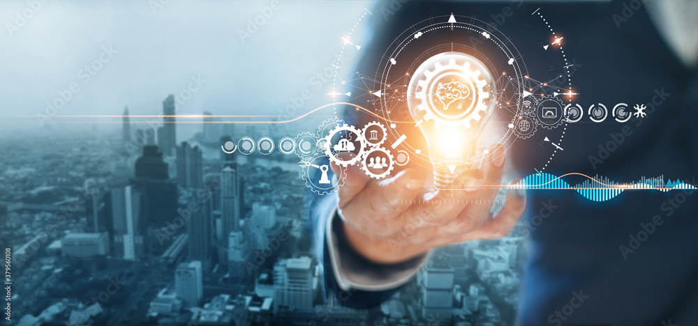 Poster Businessman holding light bulb with gears and cogs inside, Symbolic of creativity innovative solution analysis and development contents of business and process workflow on global network connection.