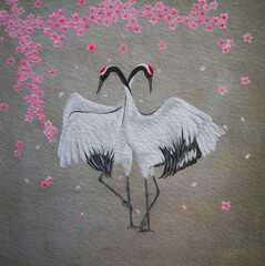 Grus cranes under sakura tree