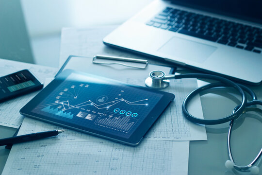 Healthcare Business Concept, Medical Examination And Graph Data Growth Of Business On Tablet With Doctor's Health Report Clipboard On Background.