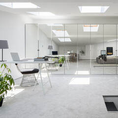 Attic room with mirrors on wardrobe doors