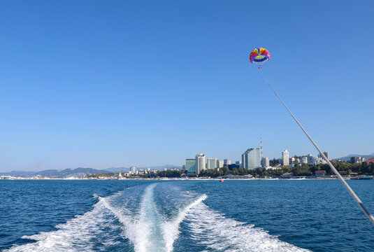 Parasailing, view from the boat. Sochi, Russia.
