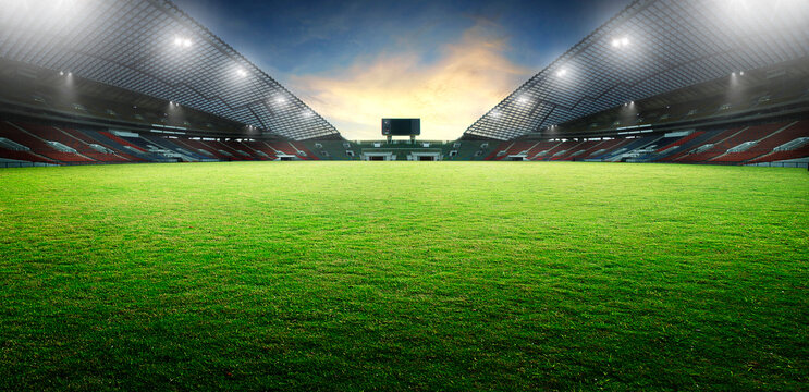 Fototapeta Sunset scene illumination soccer stadium and green grass field. 3D rendering