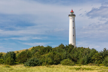 Fototapeta na wymiar Lighthouse in the dunes of Lyngvig, Jutland, Denmark