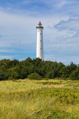 Fototapeta na wymiar Lighthouse in the dunes of Lyngvig, Jutland, Denmark