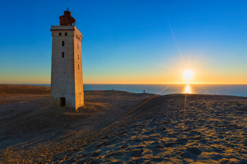Fototapeta na wymiar Lighthouse of Rubjerg Knude, Denmark, in a beautiful sunset