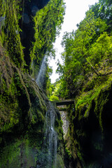 Waterfall with little water in the summer in the canyon of the Los Tinos natural park on the northeast coast on the island of La Palma, Canary Islands Spain