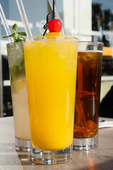 Summer refreshment vibes - colorful and tasty cold cocktails on the beach of Cyprus