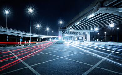 Freeway in night with cars light in crossroads