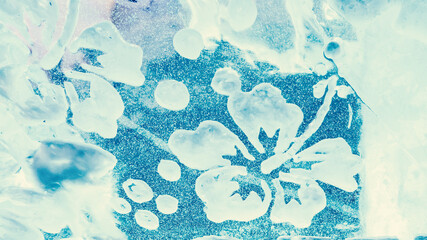 Winter ice background. Flower ornament made of ice