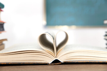 Turned pages of love shape