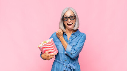 middle age woman feeling happy, positive and successful, motivated when facing a challenge or celebrating good results movie concept