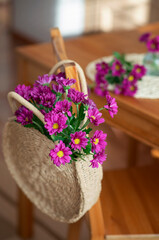 Still-life. Purple chrysanthemums in a bag.