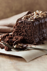 Chocolate cake on rustic background. Close up.	